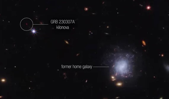 An image of GRB 230307A with the red dot on the upper left corner being the gamma ray burst's near-infrared afterglow and the galaxy on the lower right corner being its former home galaxy. (Image credit: NASA/Webb Telescope Team)