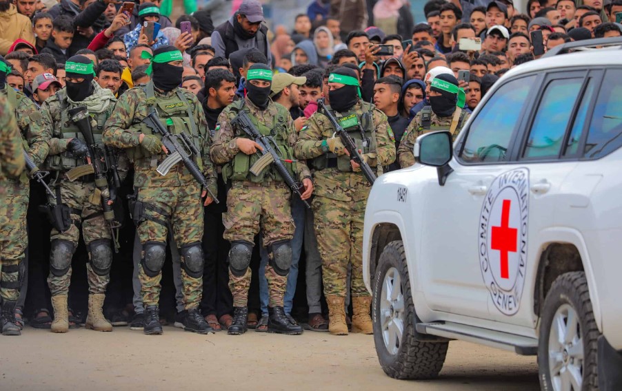 Hamas terrorists hand over three male Israeli hostages to the Red Cross, as part of the ceasefire agreement between Jerusalem and the Islamist group, in Deir al-Balah, the Gaza Strip, on Feb. 8, 2025.