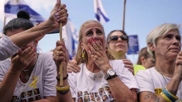 People in Tel Aviv watch a live broadcast of the Israeli hostages being released from Gaza at a plaza known as Hostages Square on October 13, 2025