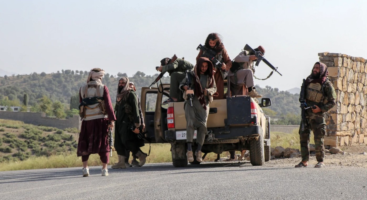 Taliban security personnel patrol a road in Zazai Maidan district of Khost province near the Afghanistan-Pakistan border on October 12, 2025