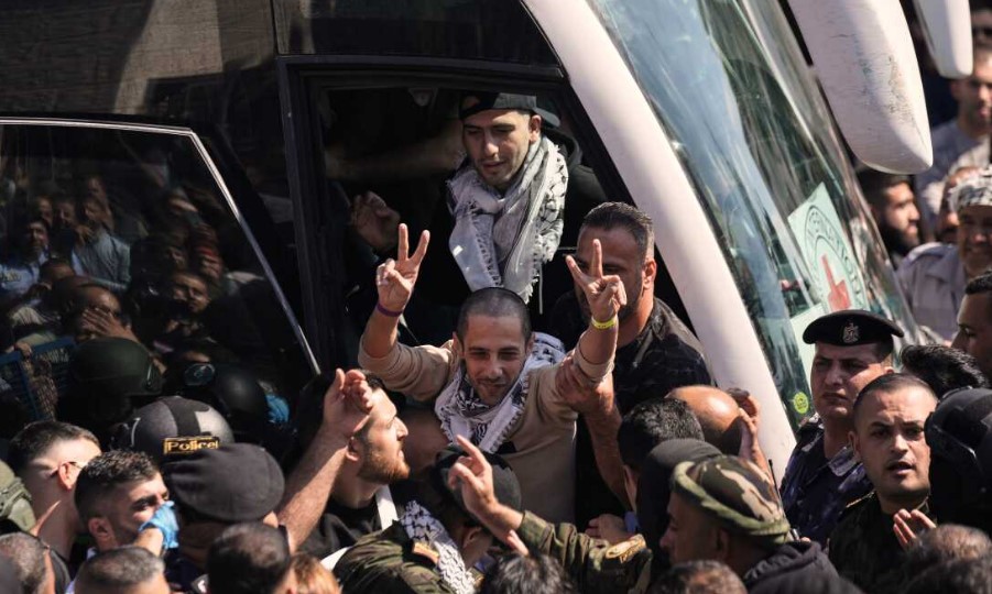 A Palestinian prisoner makes the victory sign after being released from an Israeli prison as part of a ceasefire deal between Israel and Hamas, upon his arrival in the West Bank city of Ramallah on 13th October 2025.