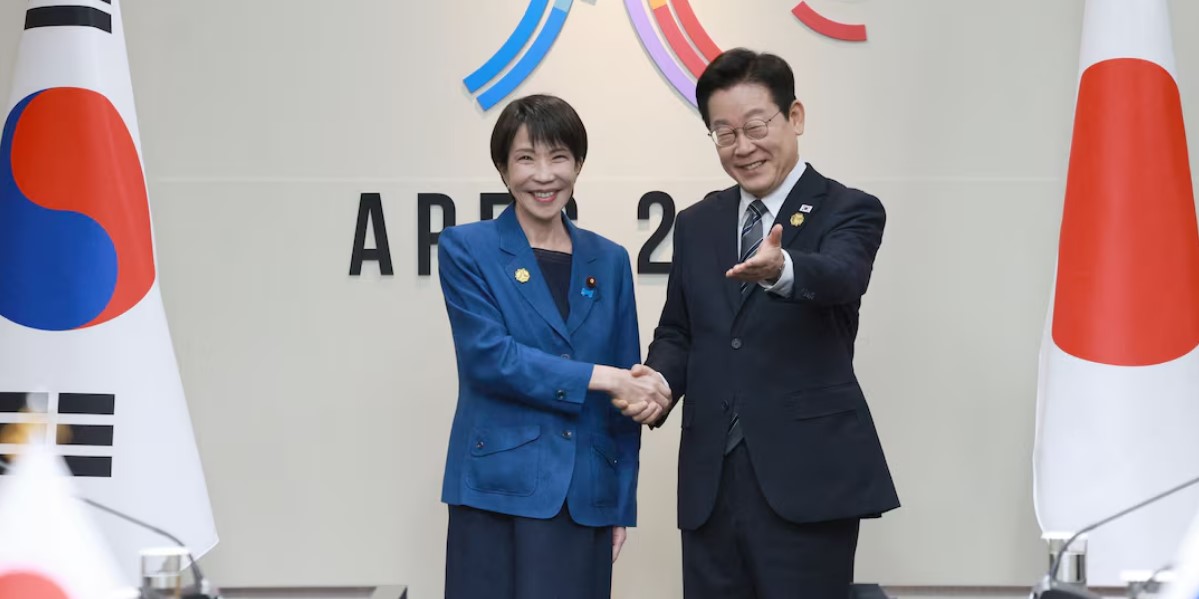 Japanese Prime Minister Sanae Takaichi is greeted by South Korea's President Lee Jae Myung during the sideline meeting of the Asia-Pacific Economic Cooperation (APEC) summit in Gyeongju, South Korea, October 30, 2025.