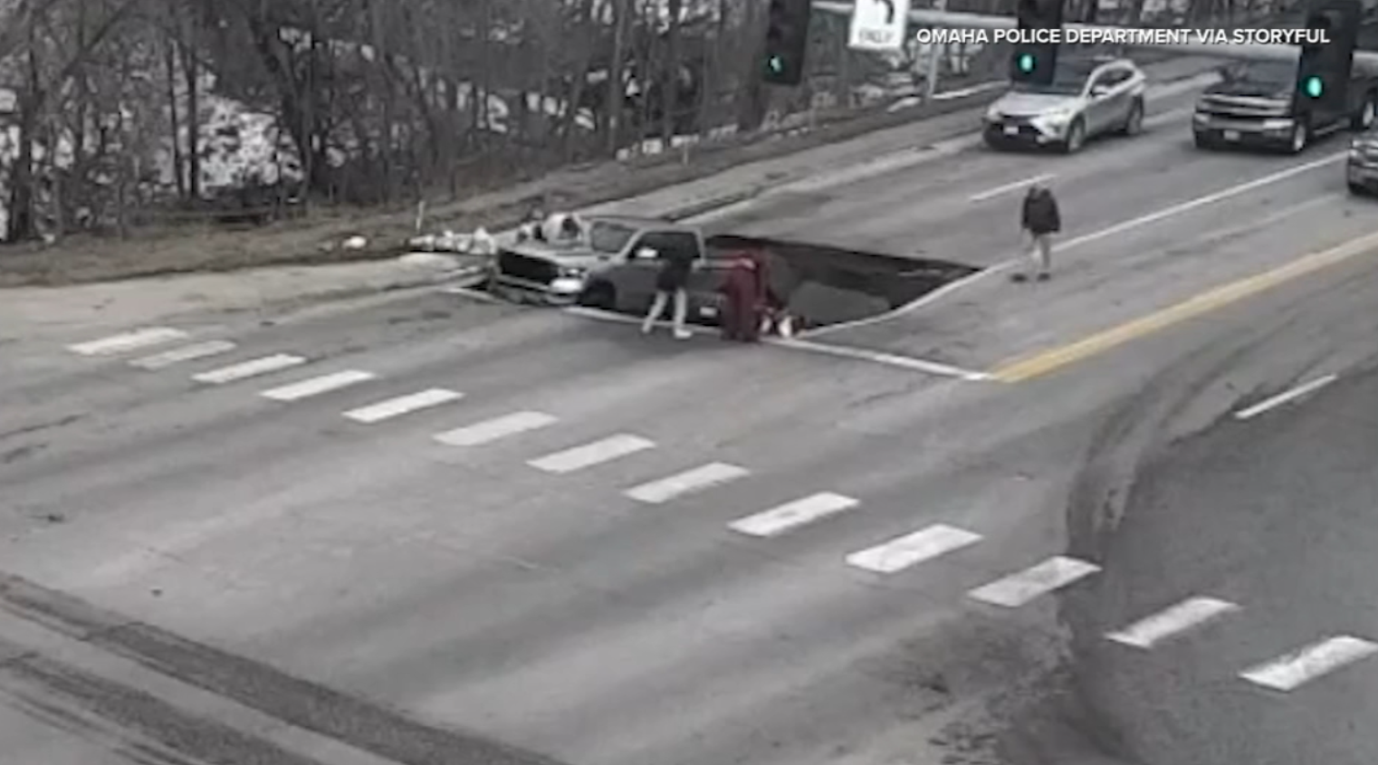 Video: Massive Sinkhole Swallows Two Cars at Omaha Intersection