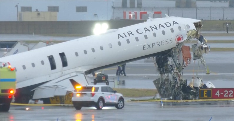 Damaged nose of Air Canada Express jet after collision
